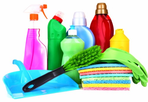 Cleaner using a vacuum in a safe and tidy workspace
